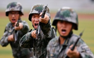 PLA soldiers practise in a drill. Photo: Reuters