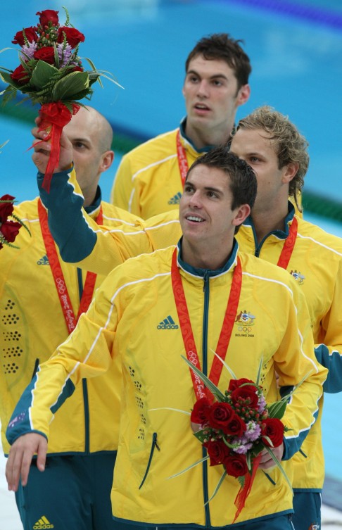 Lauterstein (right) and teammates show off their Olympic bronze medals for the 4 x100 metres freestyle event. Photo: AFP