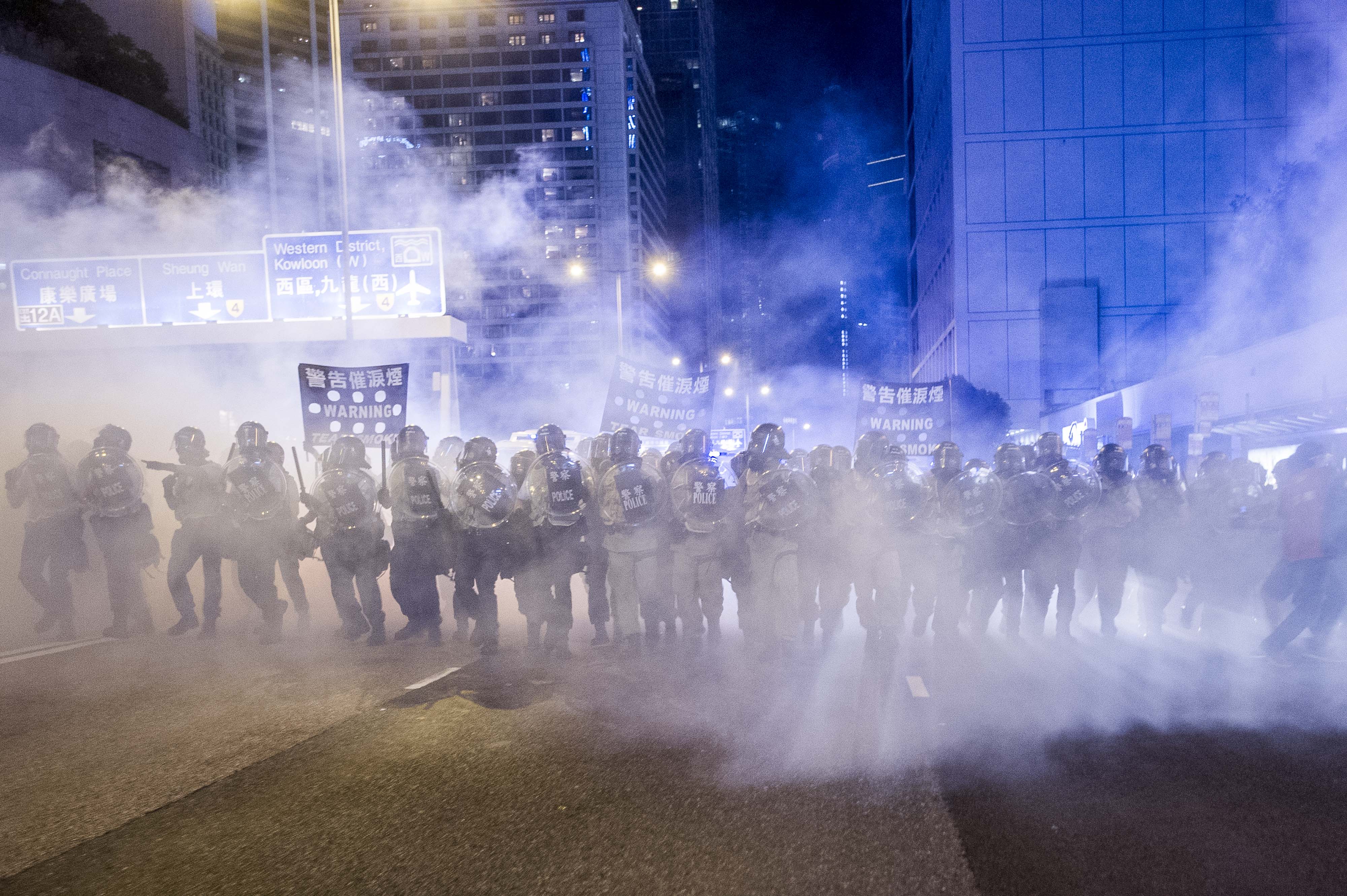 riot-police-tear-gas-crowd-afp.jpg