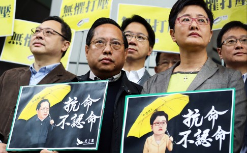 (From left) Occupy Central leader Benny Tai Yiu-ting, Democratic party's legislator Albert Ho Chun-yan and Helena Wong Pik-wan stand outside the Police headquarters in Wan Chai in March. Photo: Nora Tam